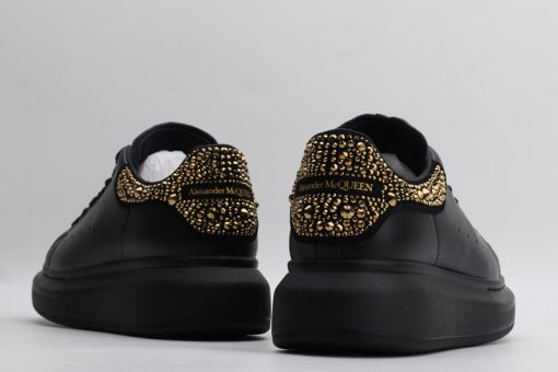 Alexander McQueen black gold tail